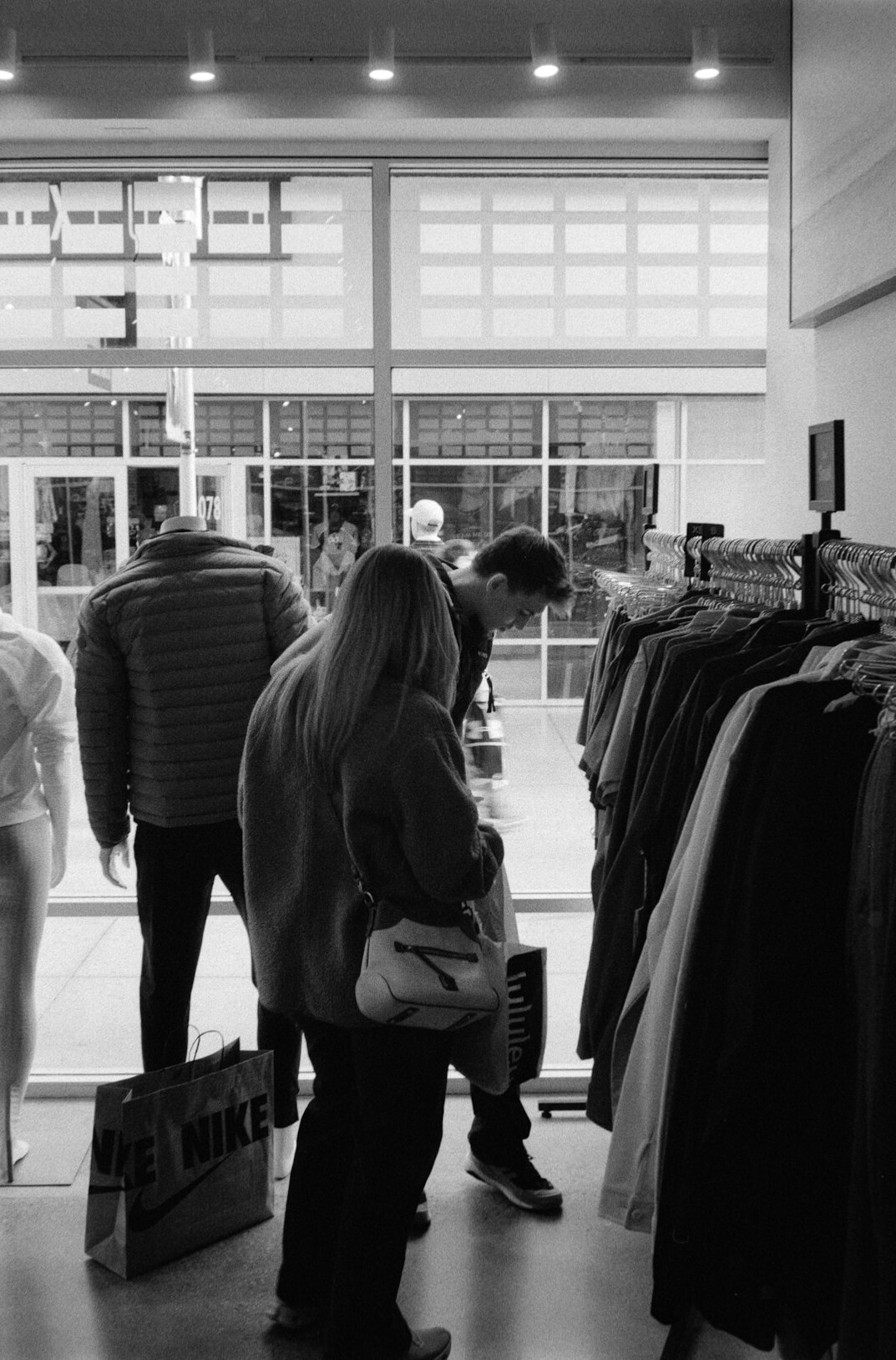 store detective watching shoppers